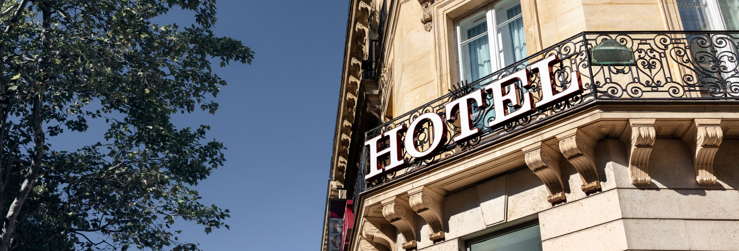 Hotel Sign On Building Facade In City